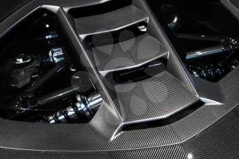 Luxury Italian sports car fragment, rear aerodynamics carbon spoiler covers engine compartment