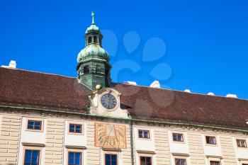 Amalienburg facade with sundial and clock, Vienna, Austria