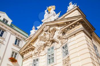 Vienna, Austria. Old decorative facade with statues and coat of arms. Burgerliches Zeughaus located in First District, Innere Stadt, Am Hof square