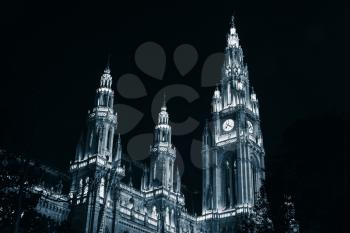 Rathaus of Vienna. Town Hall facade at night, blue toned monochrome photo