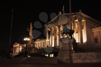 Austrian Parliament at night, was erected between 1893 and 1902 by Carl Kundmann, Josef Tautenhayn, Hugo Haerdtl