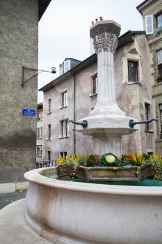 Street fountain in old town of Geneva city, Switzerland