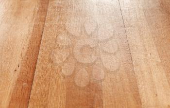 Wooden parquet flooring perspective. Close up background photo