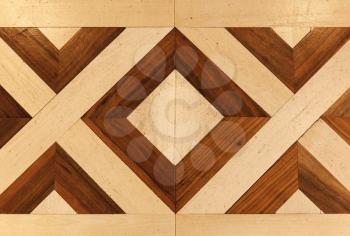 Old wooden parquet with geometric pattern. Flat background photo texture