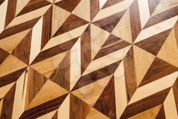 Old wooden parquet flooring design, geometric pattern. Background photo texture