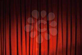 Wavy red velvet curtain with spot illumination, background photo texture