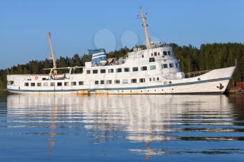 Moored old white passenger ship on the coast of Saimaa lake, Finland