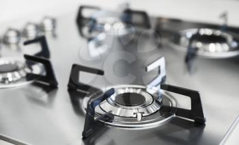 Luxury gas stove burners made of shiny stainless steel and cast iron