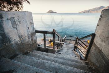 Perspective view of old stairs going down to the sea coast, Zakynthos island, Greece