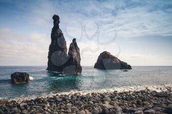 Pebble beach and rocky Islets of the Ribeira da Janela, Madeira island, Portugal