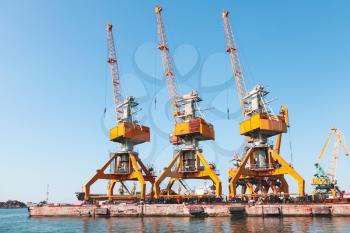 Port cranes stand on the pier in Burgas harbor, Black Sea, Bulgaria