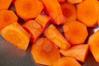 Sliced orange carrots, macro photo with selective focus
