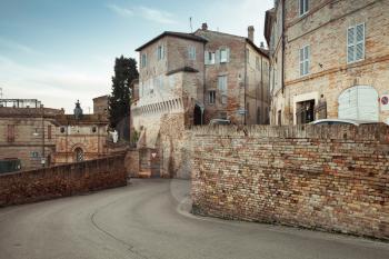 Street view of Fermo town with old houses, Italy. Vintage toned photo
