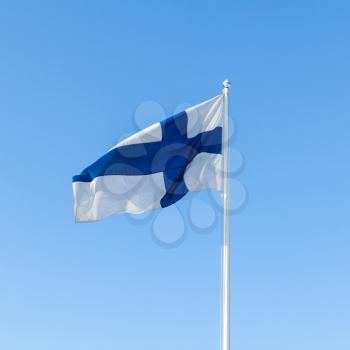 Flag of Finland waving over blue sky background