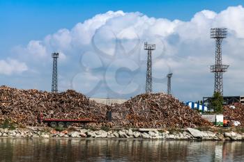 Pile of rough logs lies on the quay in Burgas port, Bulgaria