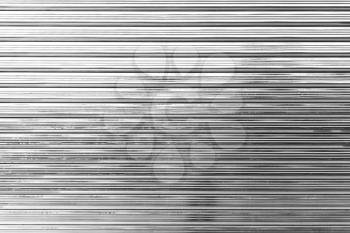 Shininy corrugated metal fence, standard industrial wall, background photo texture