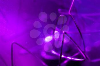 Decorative purple tungsten lamp parts, macro photo with selective focus and shallow DOF