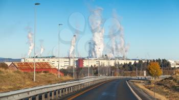 Landscape with smoke over pulp mill factory in Skogn, Norway