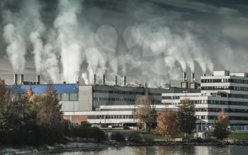Dark toned Industrial landscape with thermomechanical pulp mill factory in Skogn, Norway