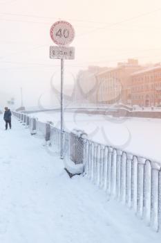 Frosted speed limit road sign on the coast of Griboedov canal in winter season. Saint Petersburg, Russia
