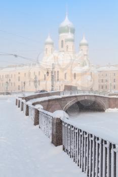 Griboyedov Canal embankment with Saint Isidore Church in winter. Saint-Petersburg, Russia