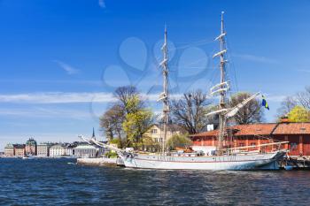 White sailing ship moored near Skeppsholmen island, one of the islands of Stockholm city, Sweden