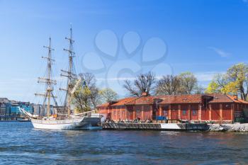 Old white sailing ship moored near Skeppsholmen, one of the islands of Stockholm, Sweden