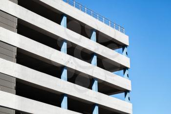 Modern parking lot building exterior, abstract fragment over blue sky background