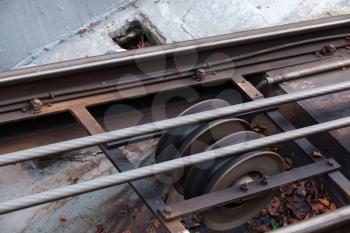 Funicular details. Rails, moving traction cable and support rollers