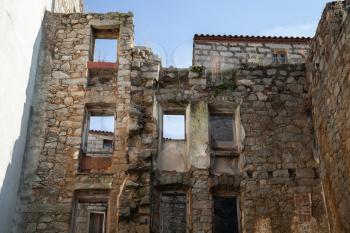 Abandoned stone house wall. Sartene, South Corsica, France