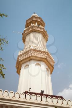 Minaret of Sharif Hussein Bin Ali in Aqaba city, Hashemite Kingdom of Jordan. Vertical photo over blue sky