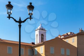 Ajaccio city view with street lamp and dome of Eglise St Erasme. Corsica island, France