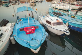 Small wooden fishing boats moored in old port of Ajaccio, Corsica, France