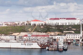 Shipyard in Sevastopol Bay, seaside cityscape in spring day. Crimea