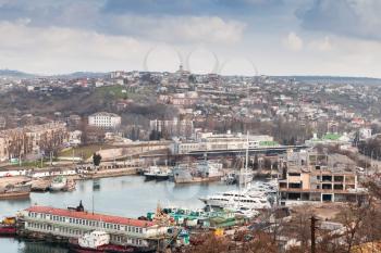 Shipyards of Sevastopol Bay, seaside cityscape in spring day