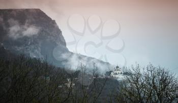 Dark mountain landscape with the Church of Christ's Resurrection. It is a popular tourist attraction on the outskirts of Yalta in the Crimea