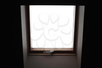 Empty closed window in dark ceiling with white background