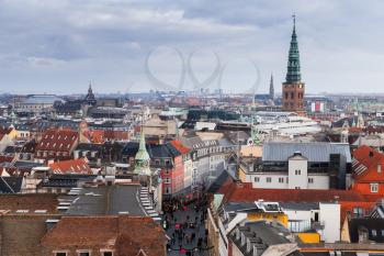 Skyline of Copenhagen with spire of City Hall at winter day. Photo taken from The Round Tower, popular old city landmark and viewpoint. Denmark