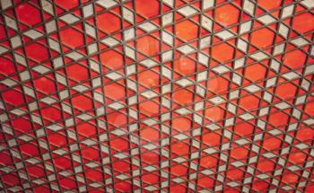 Geometric Arabic pattern, red wooden ceiling, background photo texture 