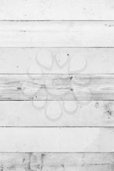White wooden wall made of planks. Frontal flat vertical background photo texture