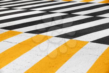 Pedestrian crossing road marking zebra on dark asphalt, background photo