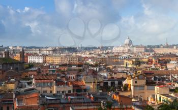 Rome, Italy. Skyline with roofs and The Papal Basilica of St. Peter in the Vatican on the horizon, photo taken from the Pincian Hill