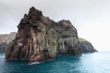 Natural wild landscape with coastal rocks of Vestmannaeyjar island, Iceland
