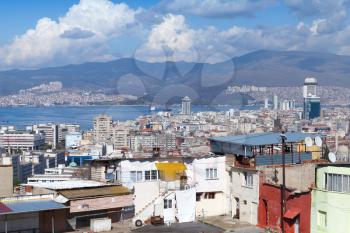 Modern urban Turkish cityscape, new and old houses are on coasts of Izmir bay