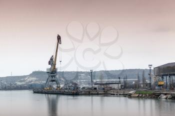 Old port crane and harbor structures in Sevastopol Bay