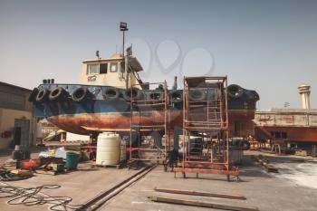 Old tugboat for repair at dock, Aqaba port
