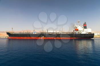 Industrial tanker ship loading in new port of Aqaba, Jordan