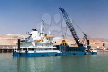 Deck cargo ship, dredging works in new Aqaba port, Jordan