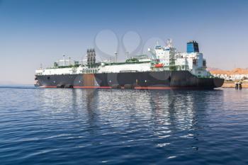 Huge oil tanker moored in new port of Aqaba, Jordan. Red Sea coast
