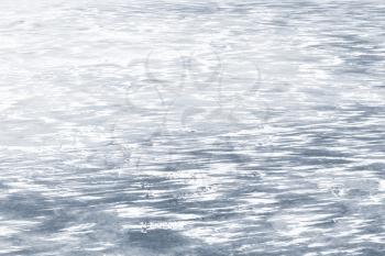 Ice on frozen river in winter season, natural background photo texture